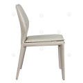 White saddle leather armless dining chairs